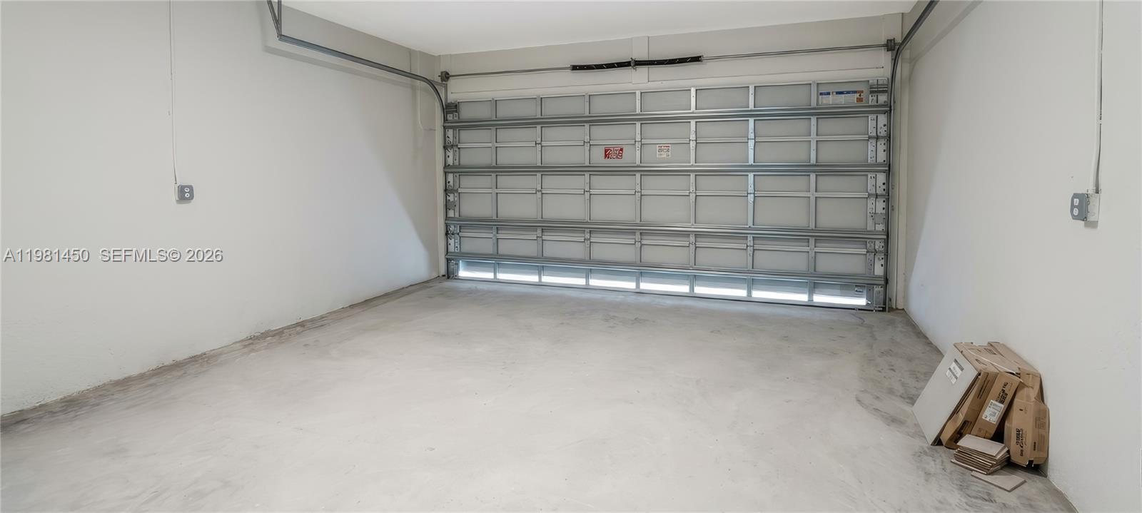 12470 Southwest 248th Street, Unit 5 Homestead, FL 33032 - Photo 18 of 18 a view of a room with racks on the wall