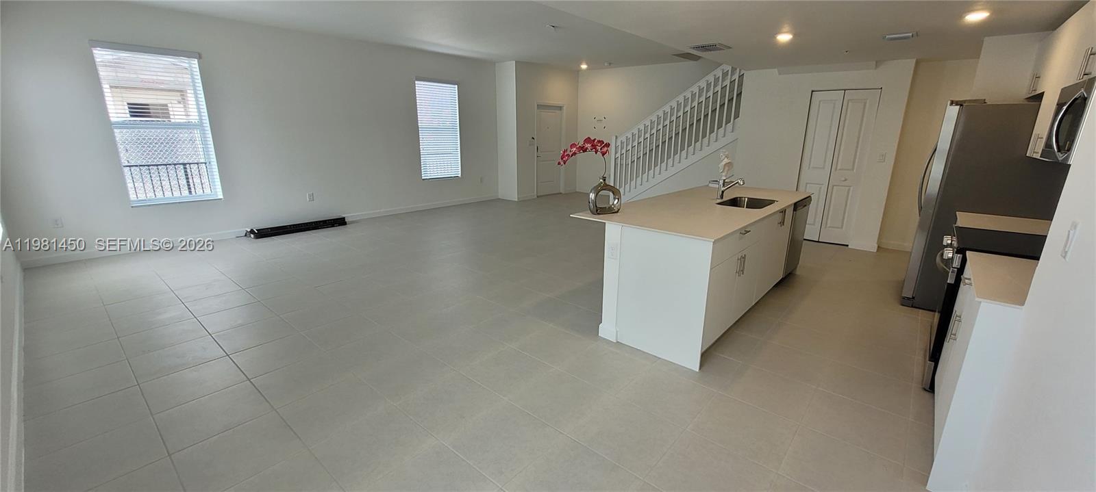 12470 Southwest 248th Street, Unit 5 Homestead, FL 33032 - Photo 9 of 18 an entryway in a hall with a window