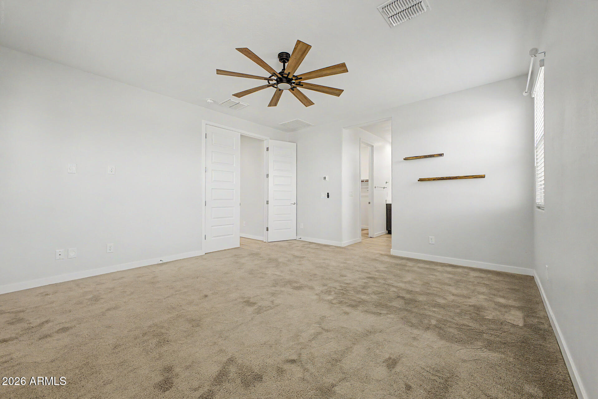 23080 East Stacey Road Queen Creek, AZ 85142 - Photo 17 of 42 a view of a livingroom with a ceiling fan and window