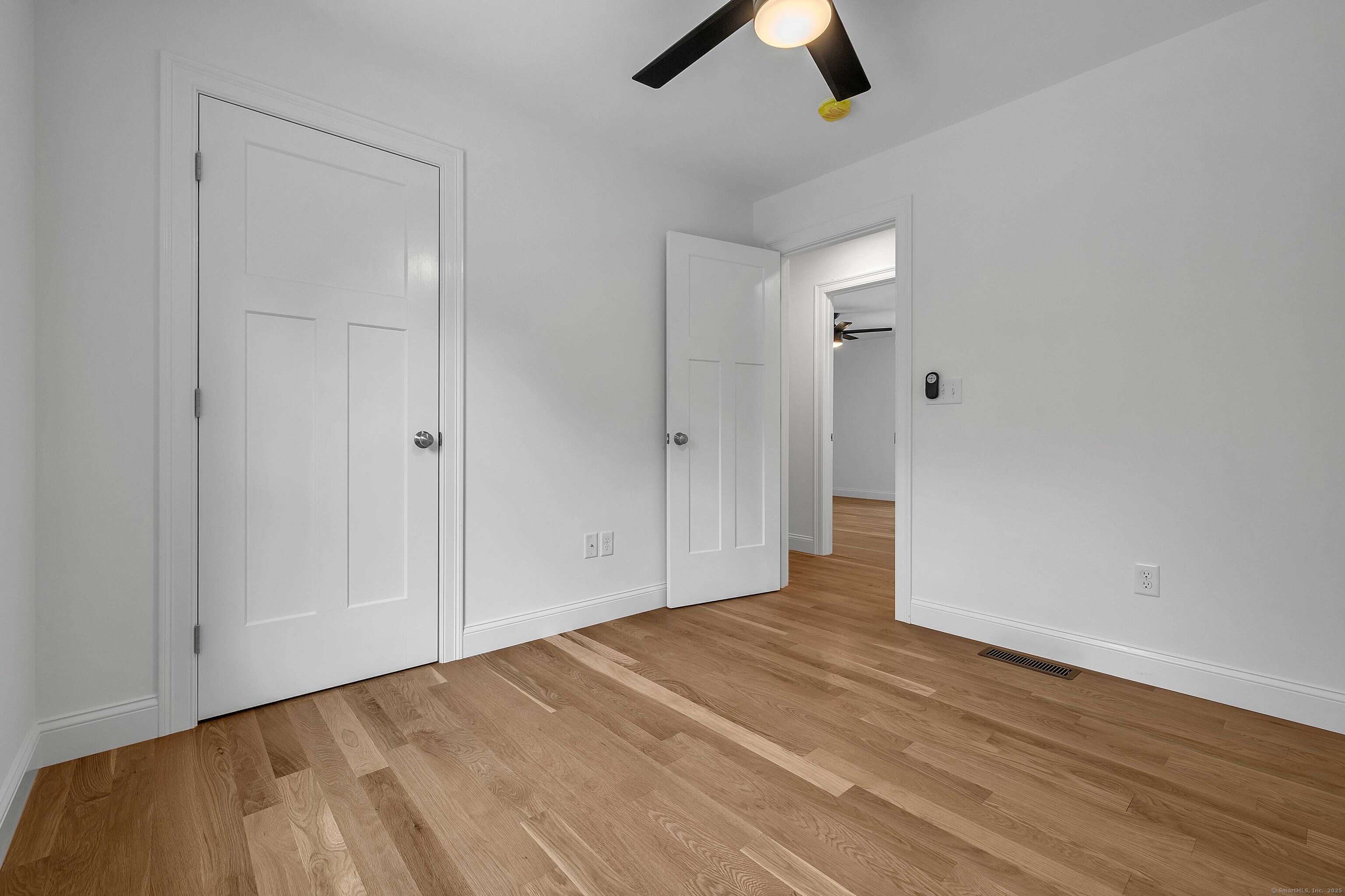 4 Lake Of Isles Road North Stonington, CT 06359 - Photo 16 of 23 wooden floor in an empty room
