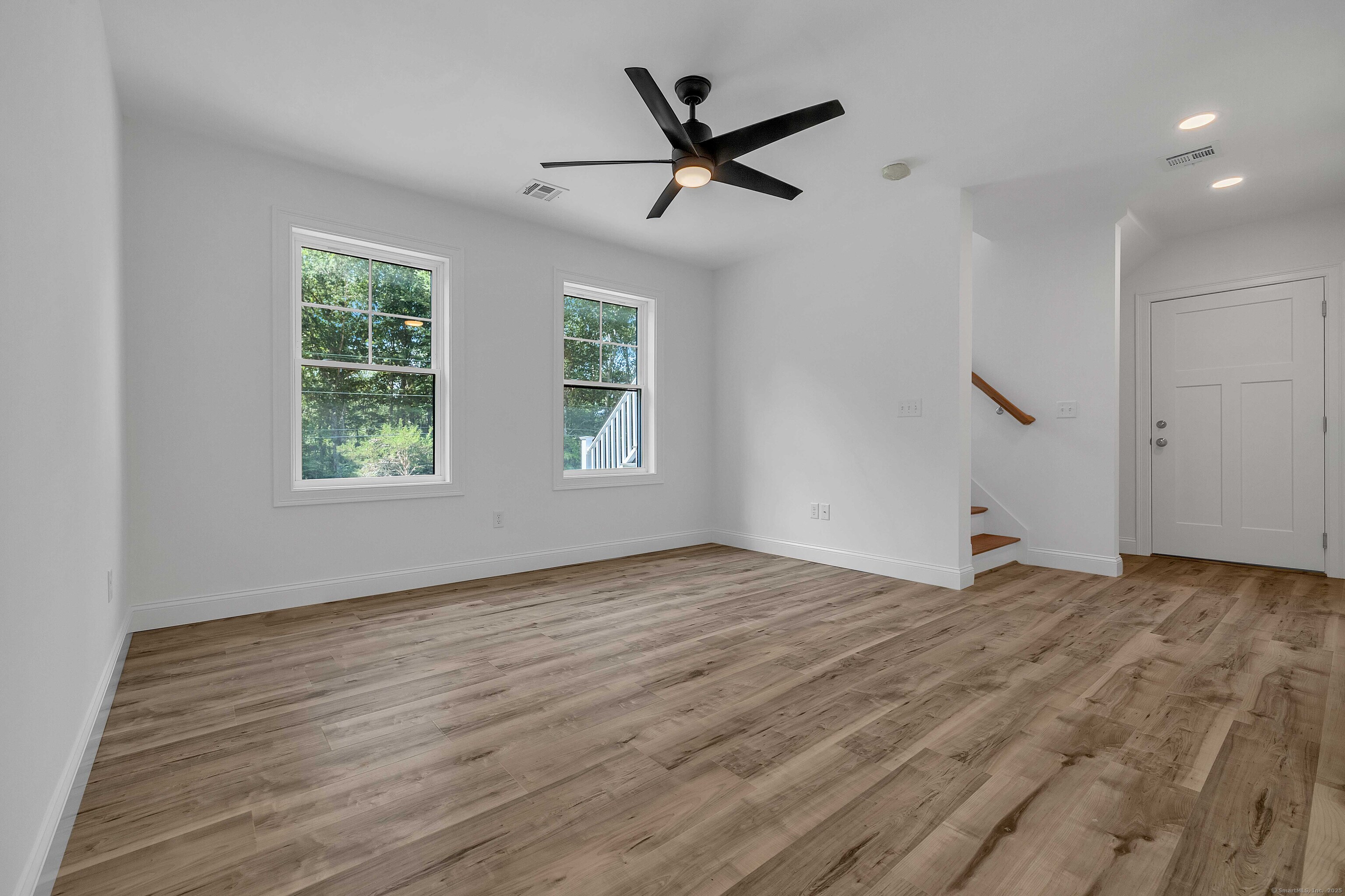 4 Lake Of Isles Road North Stonington, CT 06359 - Photo 17 of 23 a view of a livingroom with a ceiling fan and window