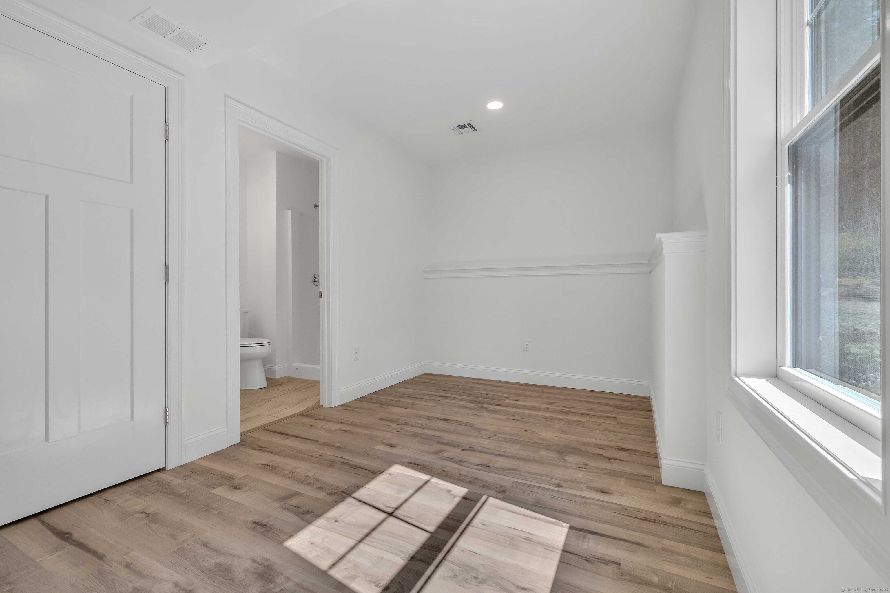 4 Lake Of Isles Road North Stonington, CT 06359 - Photo 20 of 23 a view of an empty room and window