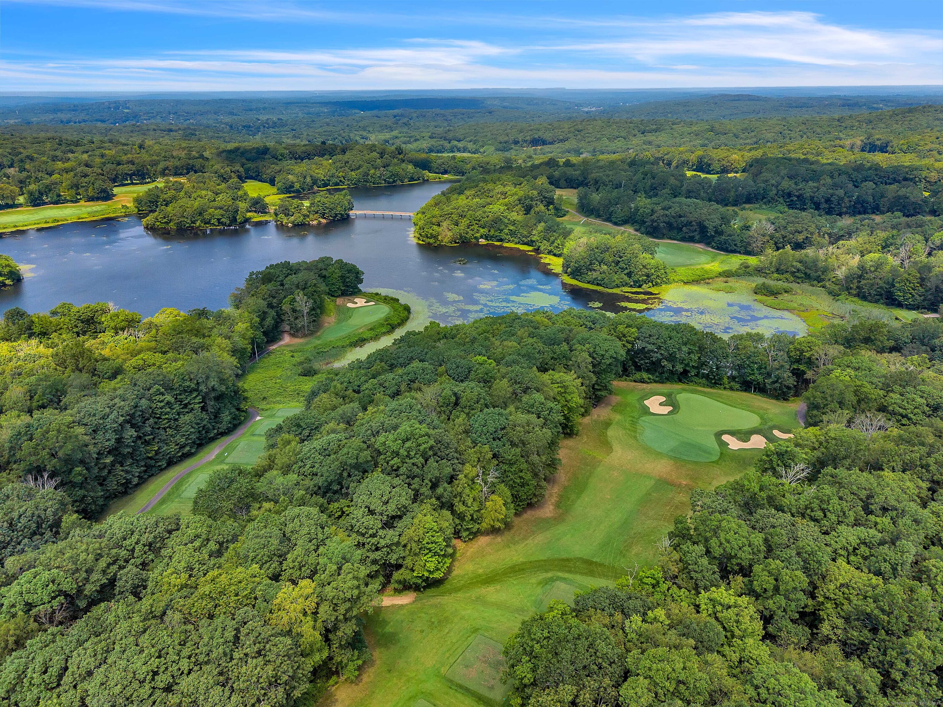 4 Lake Of Isles Road North Stonington, CT 06359 - Photo 2 of 23 a view of a lake with a houses