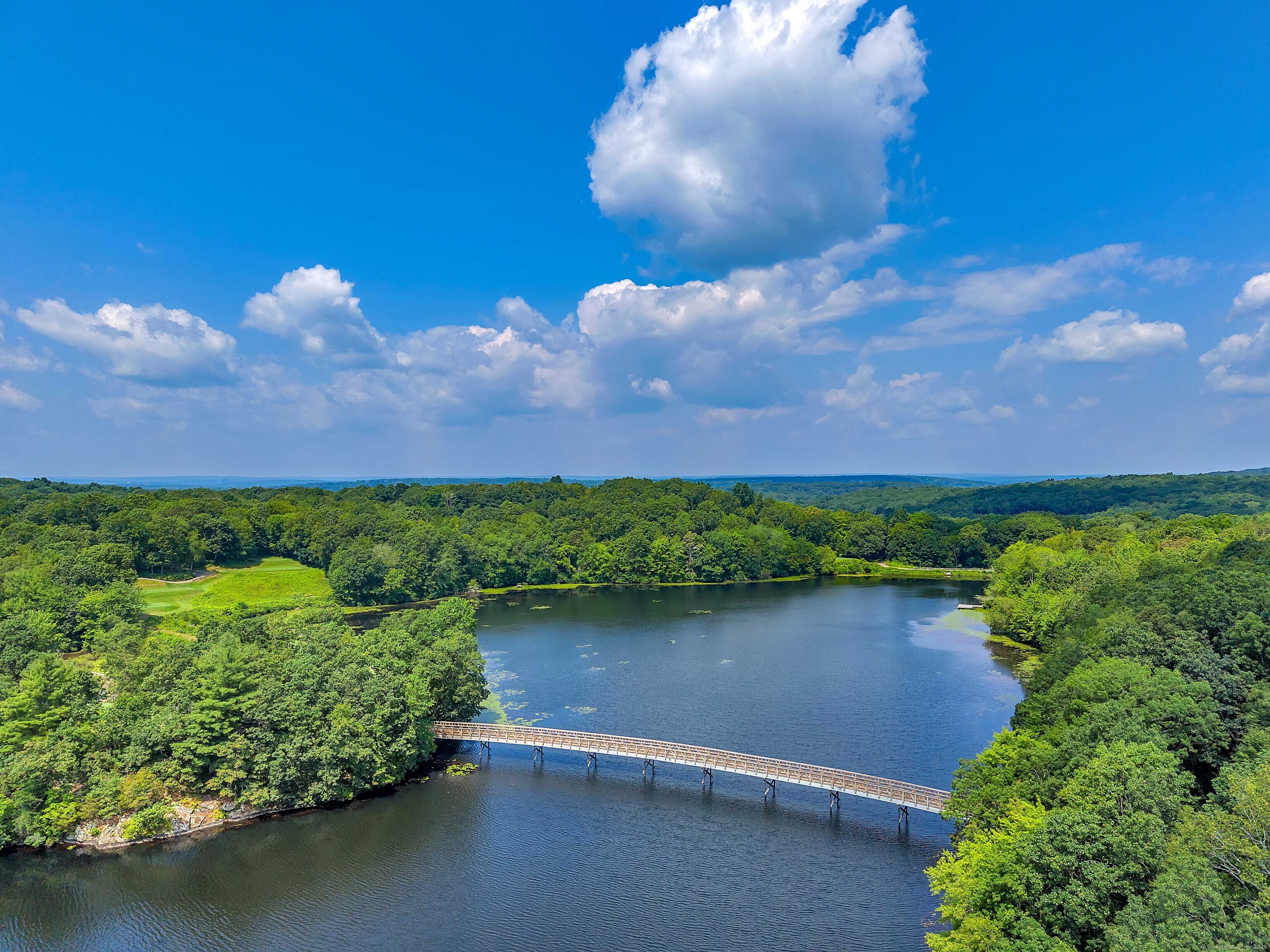 4 Lake Of Isles Road North Stonington, CT 06359 - Photo 22 of 23 a view of a garden with a lake