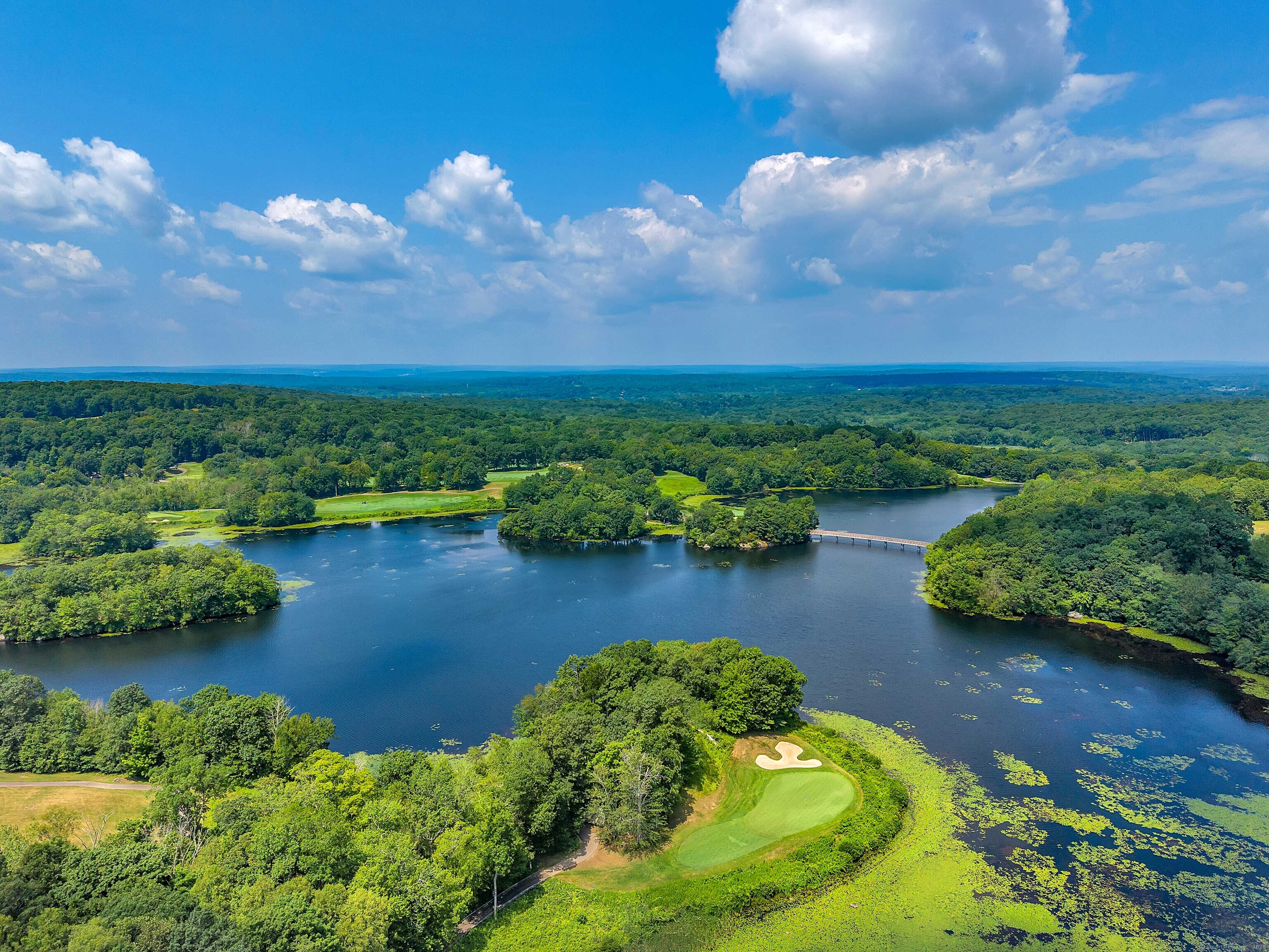 4 Lake Of Isles Road North Stonington, CT 06359 - Photo 23 of 23 a view of a lake with houses in the back