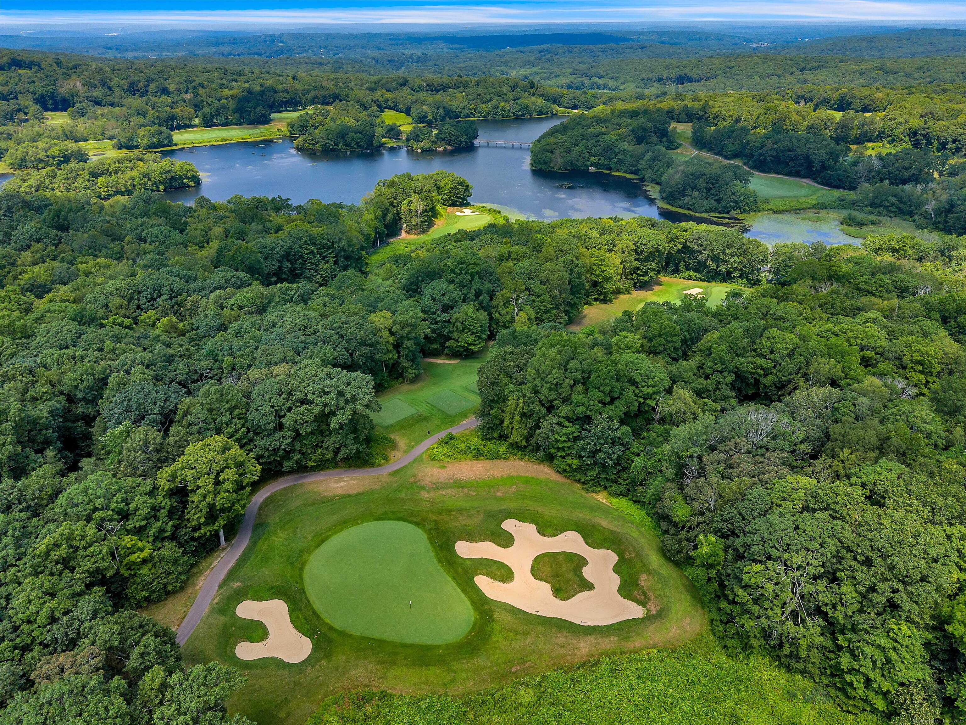 4 Lake Of Isles Road North Stonington, CT 06359 - Photo 3 of 23 an aerial view of a golf course with a swimming pool