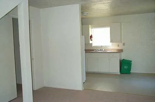 a room with a sink and cabinets