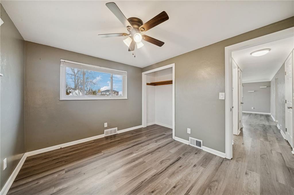 10660 Crestview Drive Irwin, PA 15642 - Photo 12 of 31 wooden floor in an empty room with a window
