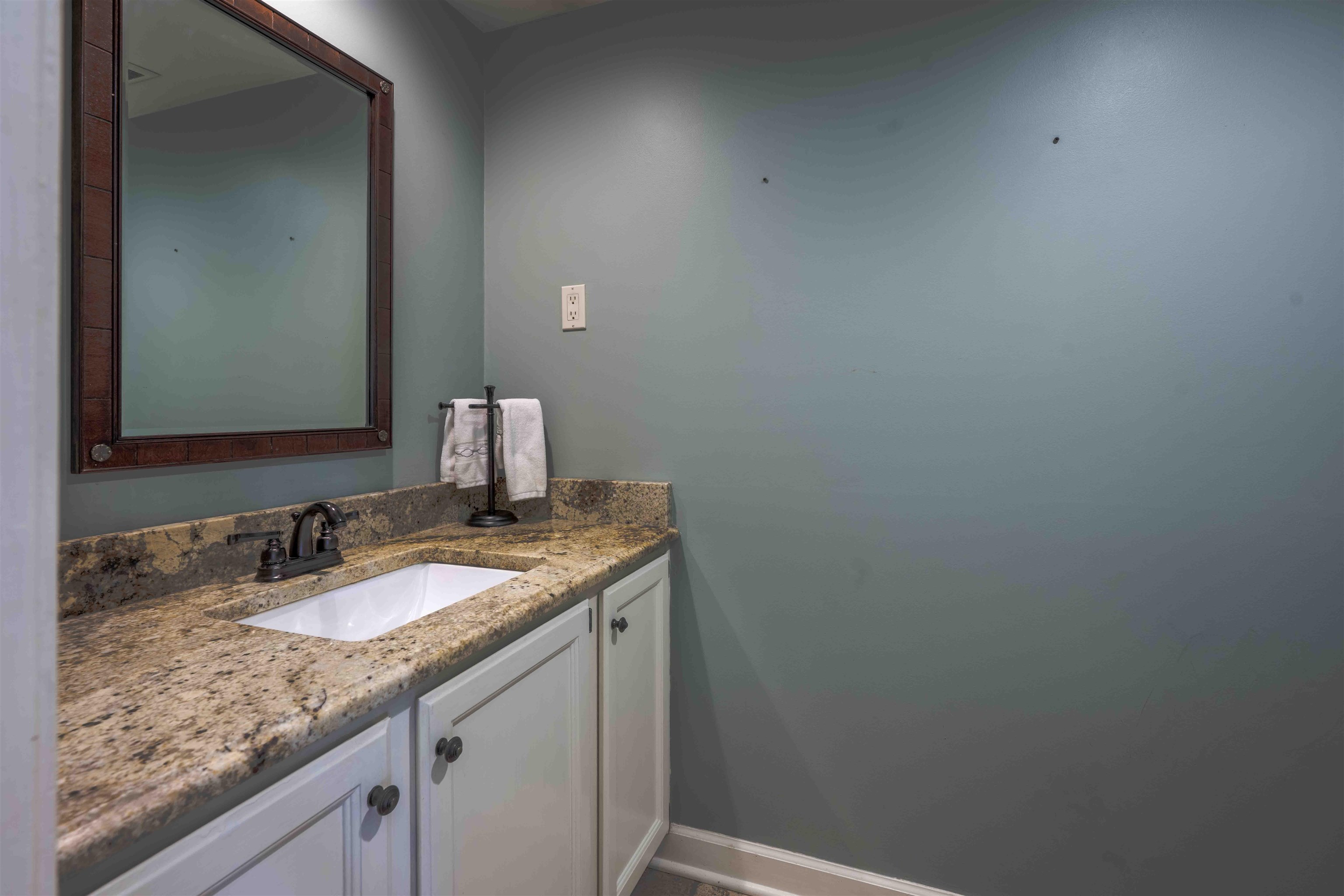 8883 Farmoor Road Germantown, TN 38139 - Photo 18 of 34 Bathroom featuring vanity and baseboards