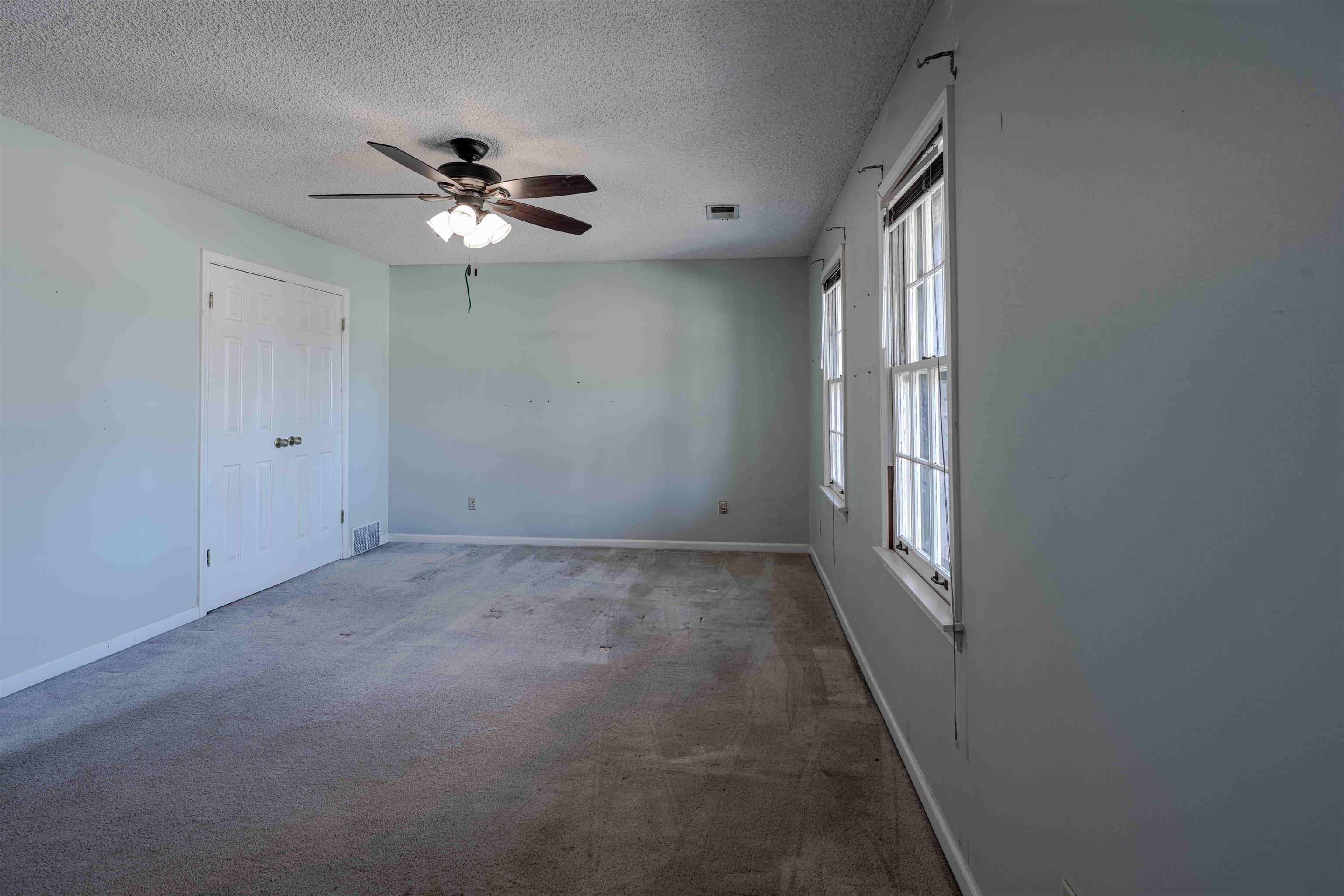 8883 Farmoor Road Germantown, TN 38139 - Photo 26 of 34 Spare room featuring carpet floors, a ceiling fan, and a textured ceiling