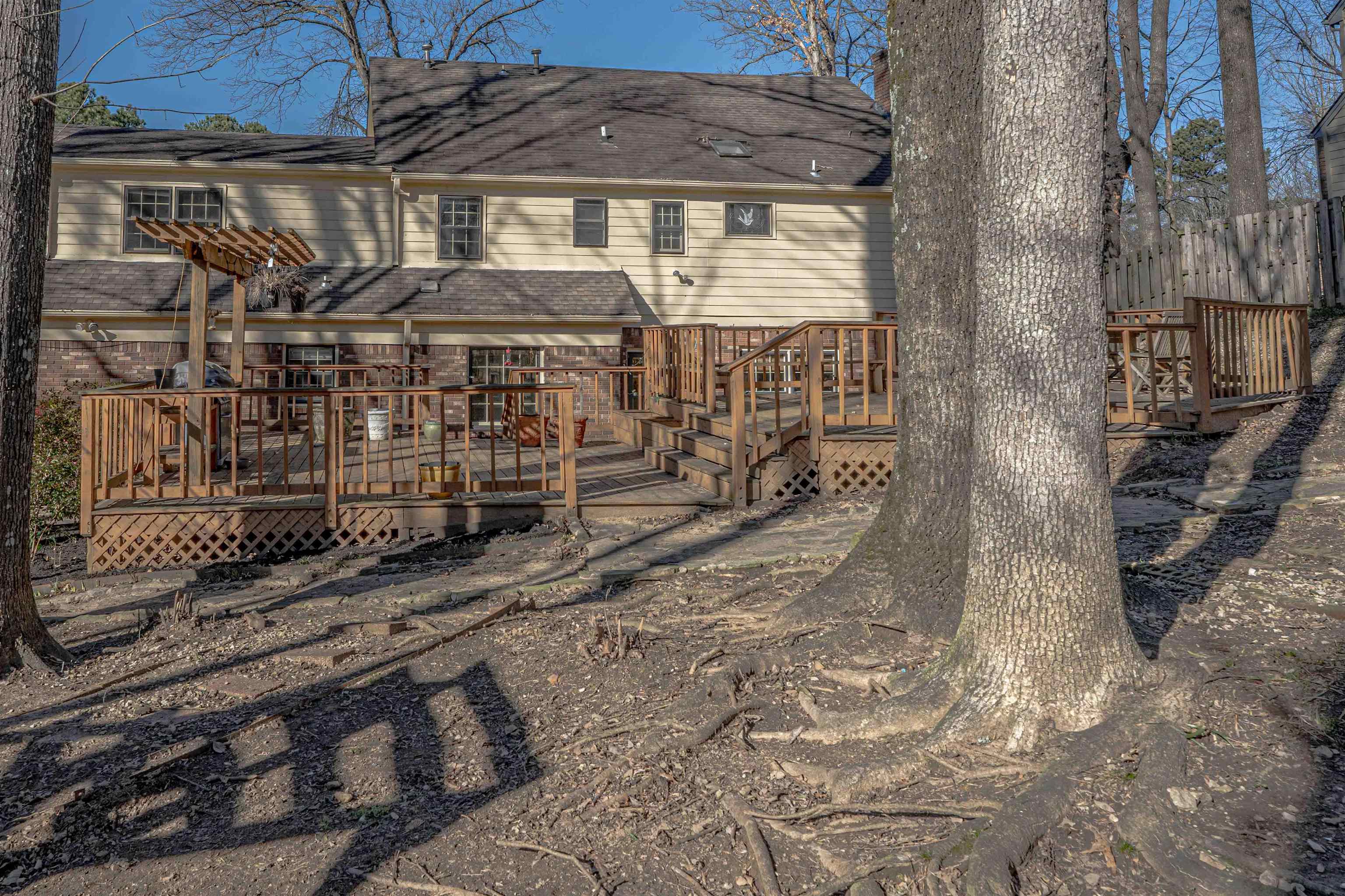 8883 Farmoor Road Germantown, TN 38139 - Photo 31 of 34 Rear view of property with a wooden deck