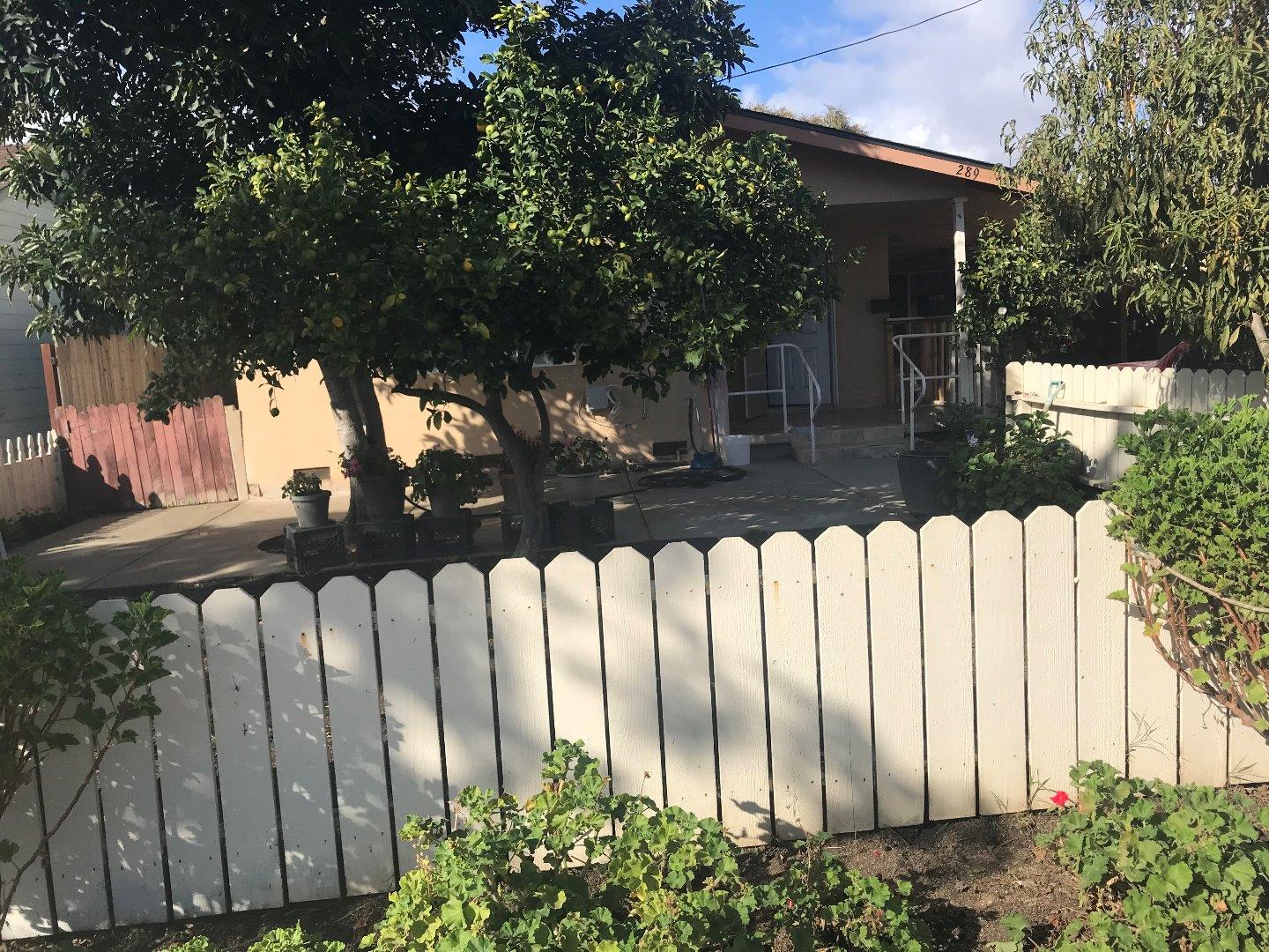 a view of a house with a small yard