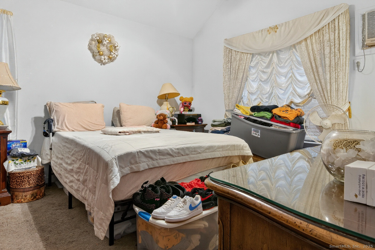 855 Oronoke Road, Unit 2 Waterbury, CT 06708 - Photo 11 of 12 a bedroom with bed and a window