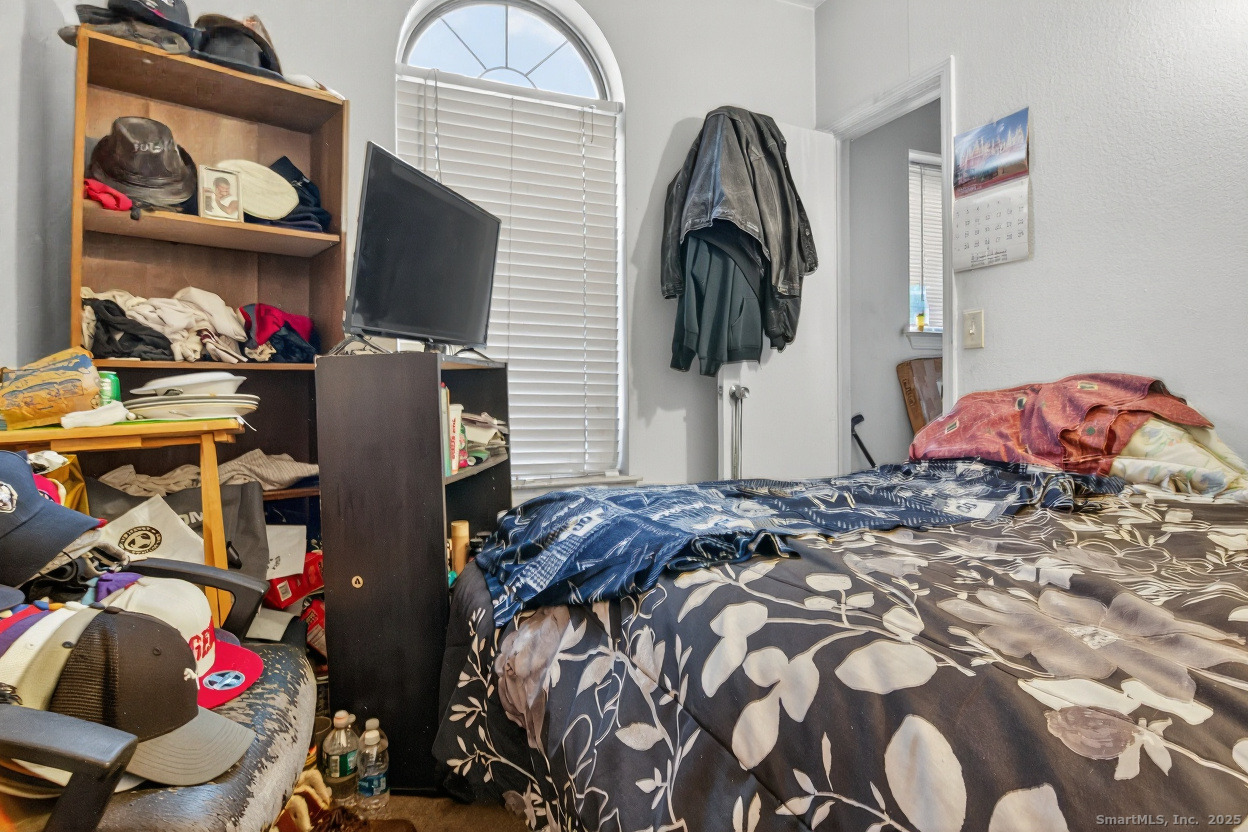 855 Oronoke Road, Unit 2 Waterbury, CT 06708 - Photo 12 of 12 a bedroom with a bed and dresser