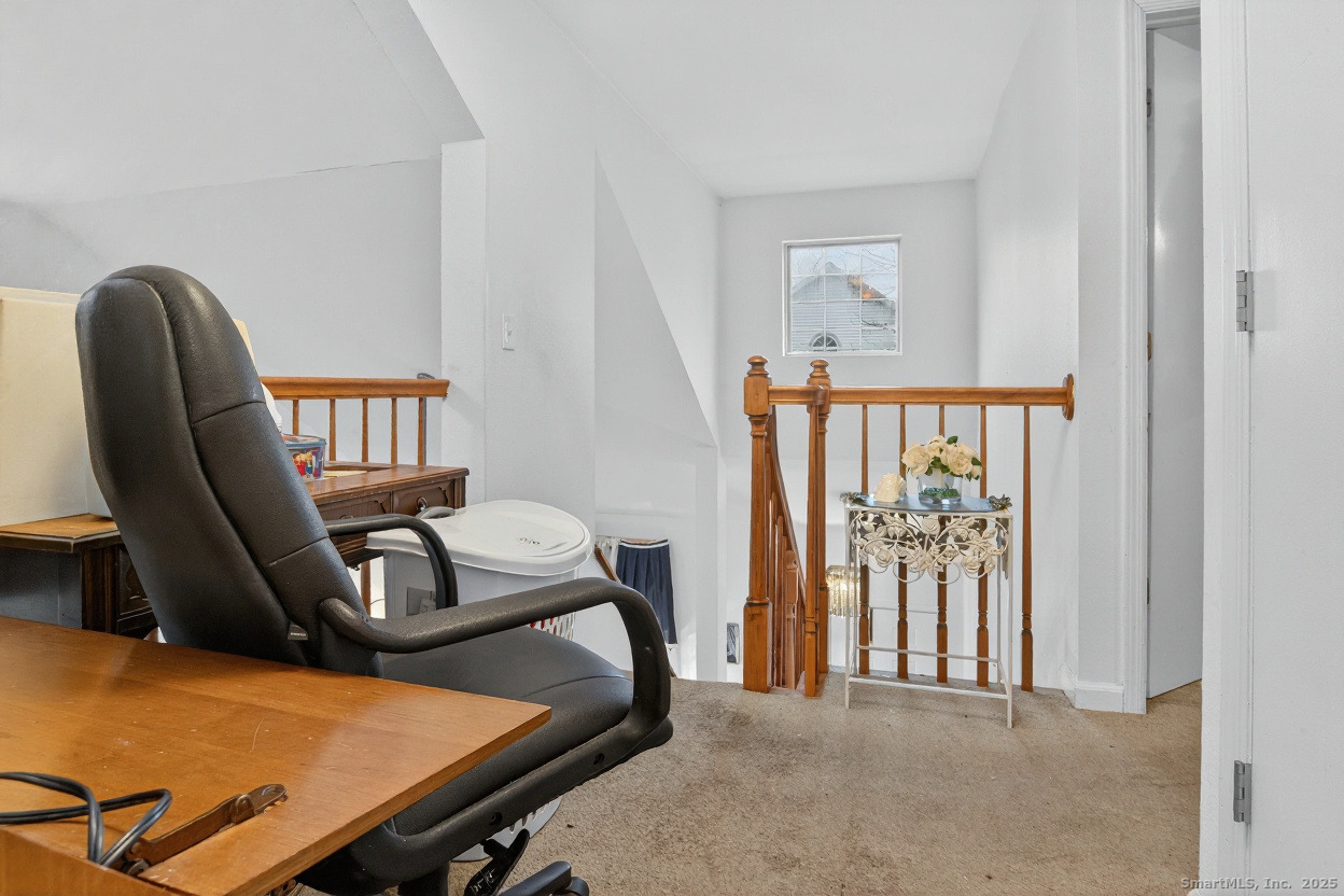 855 Oronoke Road, Unit 2 Waterbury, CT 06708 - Photo 9 of 12 a view of a workspace with furniture and staircase