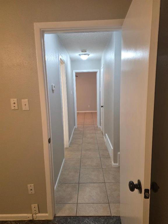 Undisclosed Address Hurst, TX 76054 - Photo 16 of 29 WALKWAY BETWEEN 2ND BEDROOM AND MASTER