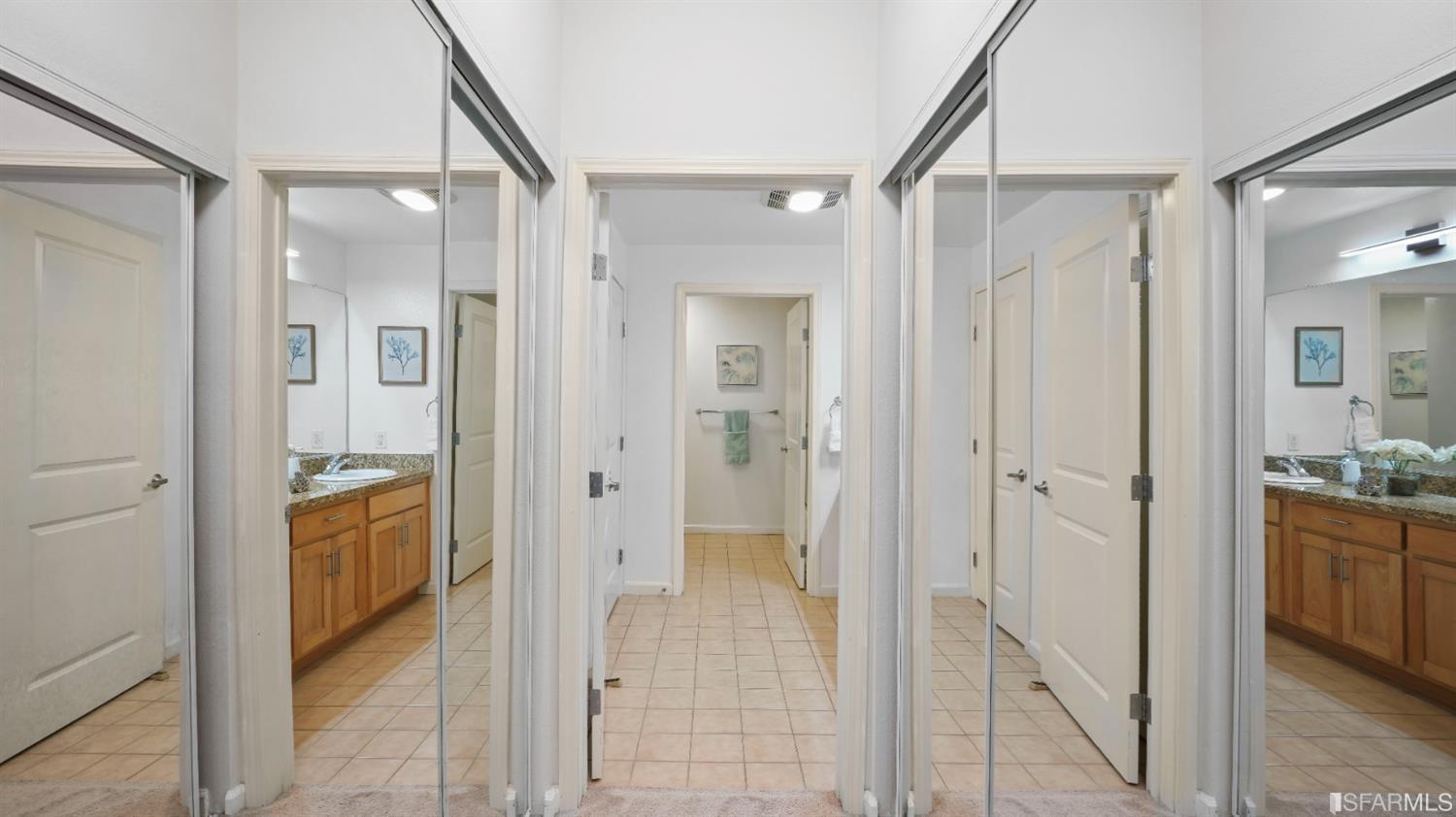 301 Crescent Court, Unit 3117 San Francisco, CA 94134 - Photo 14 of 34 a bathroom with a glass shower door a bathtub a sink and a mirror