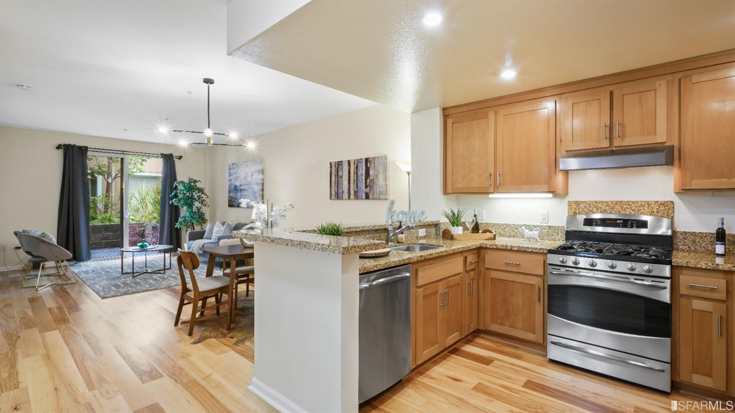 301 Crescent Court, Unit 3117 San Francisco, CA 94134 - Photo 3 of 34 a kitchen with a stove sink and cabinets