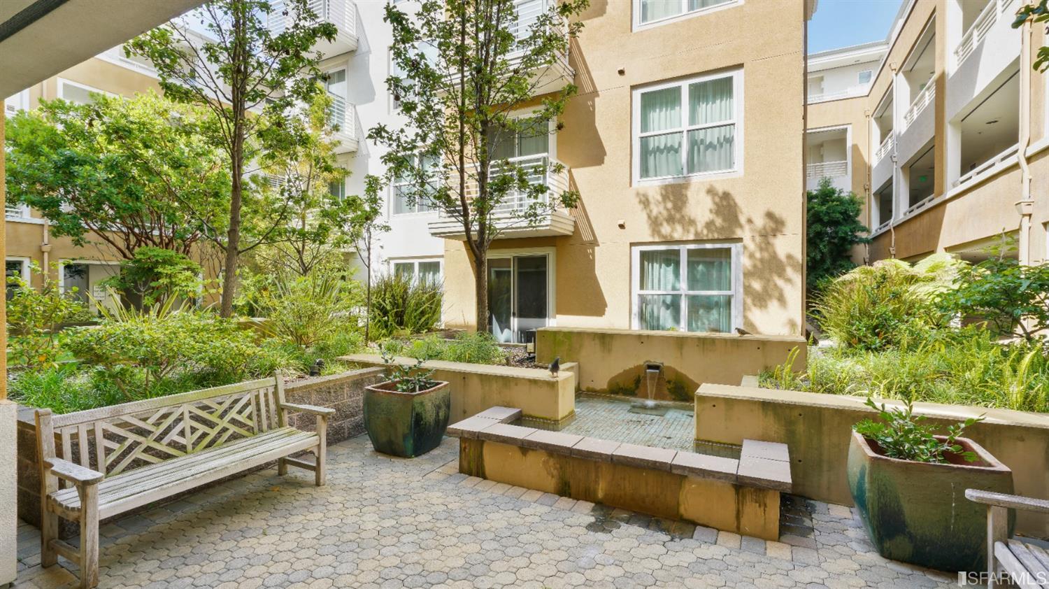 301 Crescent Court, Unit 3117 San Francisco, CA 94134 - Photo 24 of 34 a view of a patio with couches table and chairs and potted plants