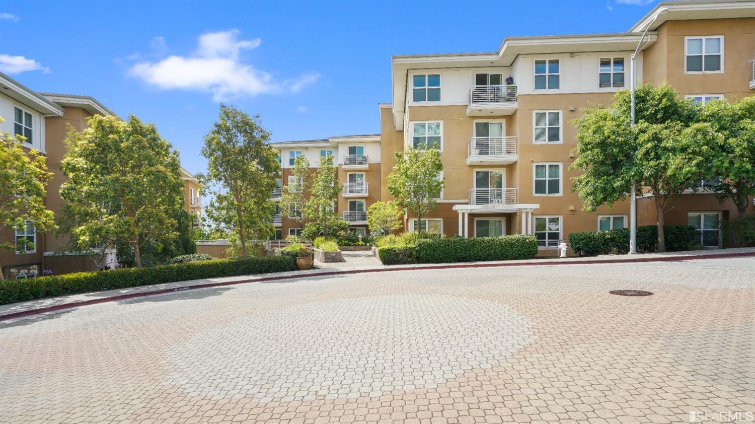 301 Crescent Court, Unit 3117 San Francisco, CA 94134 - Photo 31 of 34 a view of a brick building next to a yard