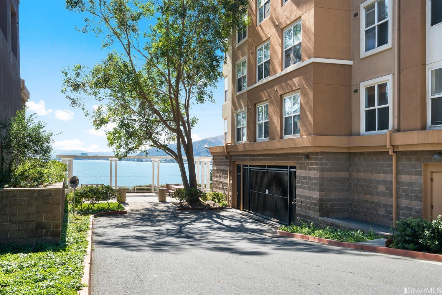 301 Crescent Court, Unit 3117 San Francisco, CA 94134 - Photo 33 of 34 a front view of a building with a garden and entryway