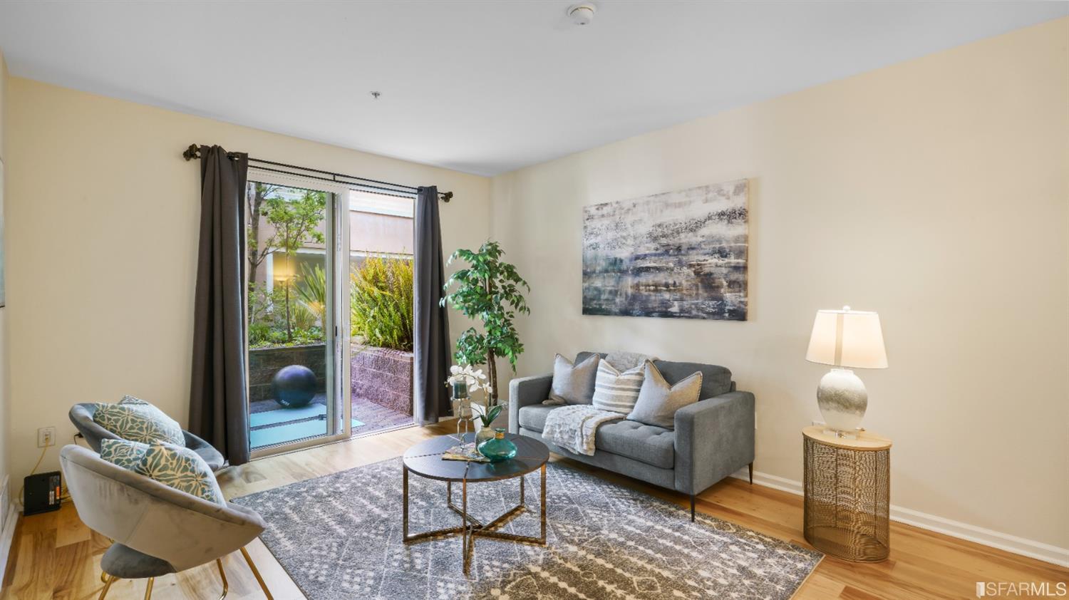301 Crescent Court, Unit 3117 San Francisco, CA 94134 - Photo 5 of 34 a living room with furniture and a window