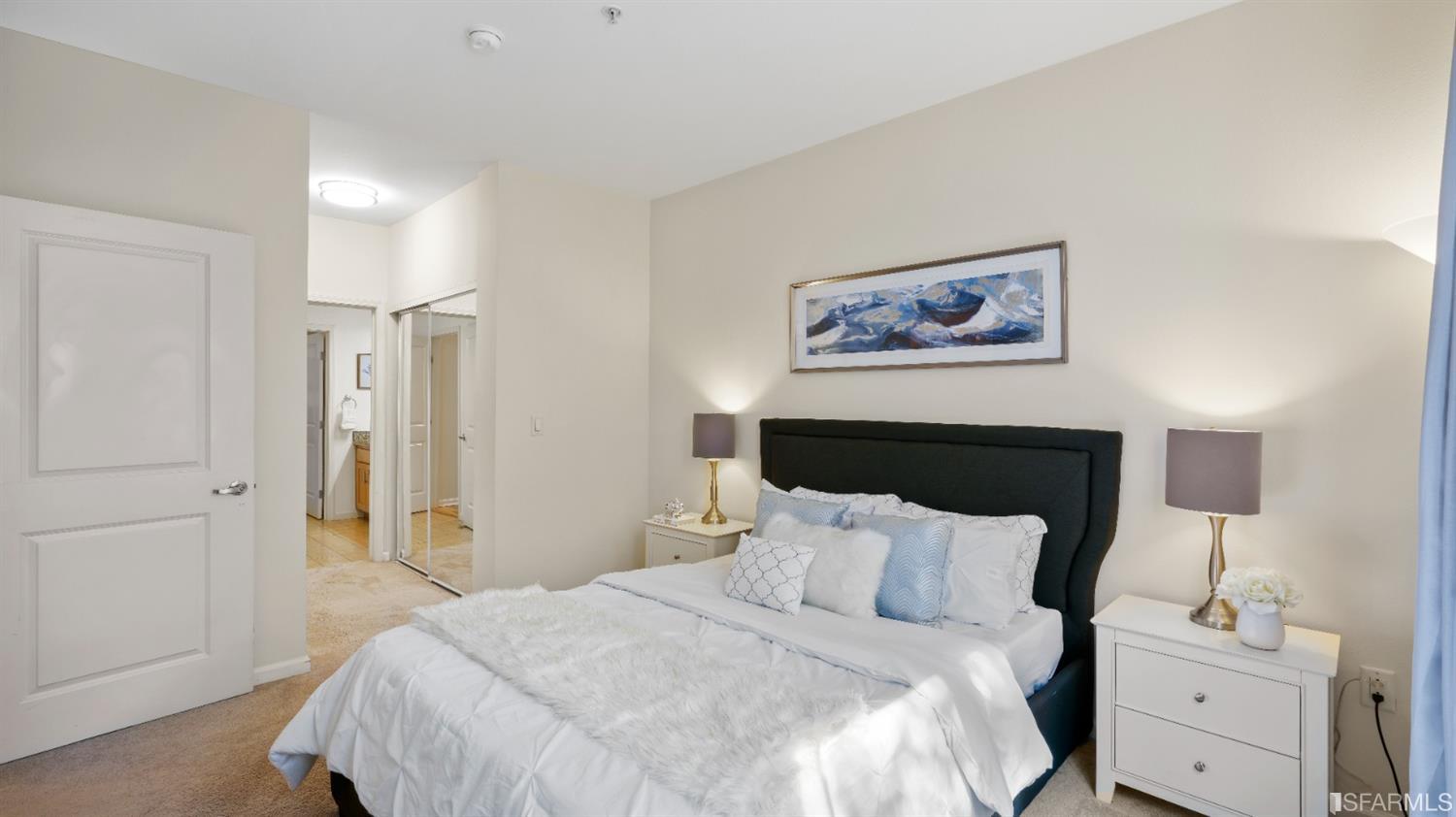 301 Crescent Court, Unit 3117 San Francisco, CA 94134 - Photo 9 of 34 a bedroom with bed and a painting on the wall
