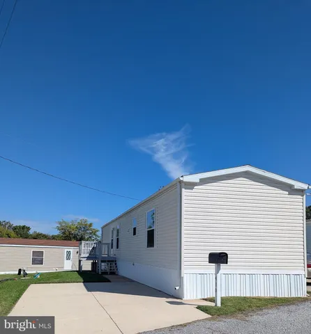 a front view of a house with a garage