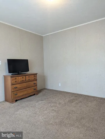 a room with furniture and flat screen tv