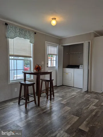 a workspace with furniture window and wooden floor