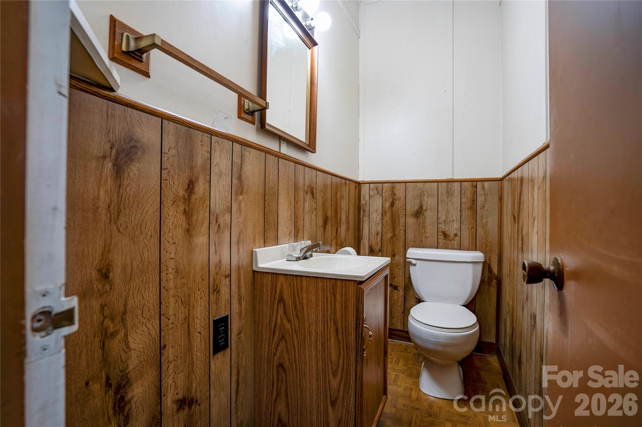 431 North Main Street Shelby, NC 28152 - Photo 27 of 37 a bathroom with a toilet a sink and mirror