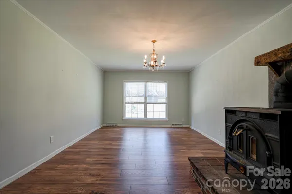 a view of a livingroom with furniture and staircase