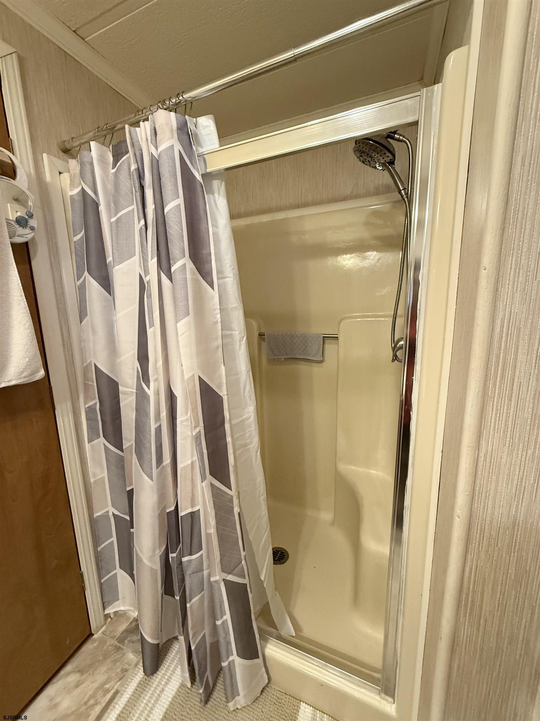 443 Priscilla Lane Buena, NJ 08310 - Photo 11 of 37 a bathroom with a shower and a glass door