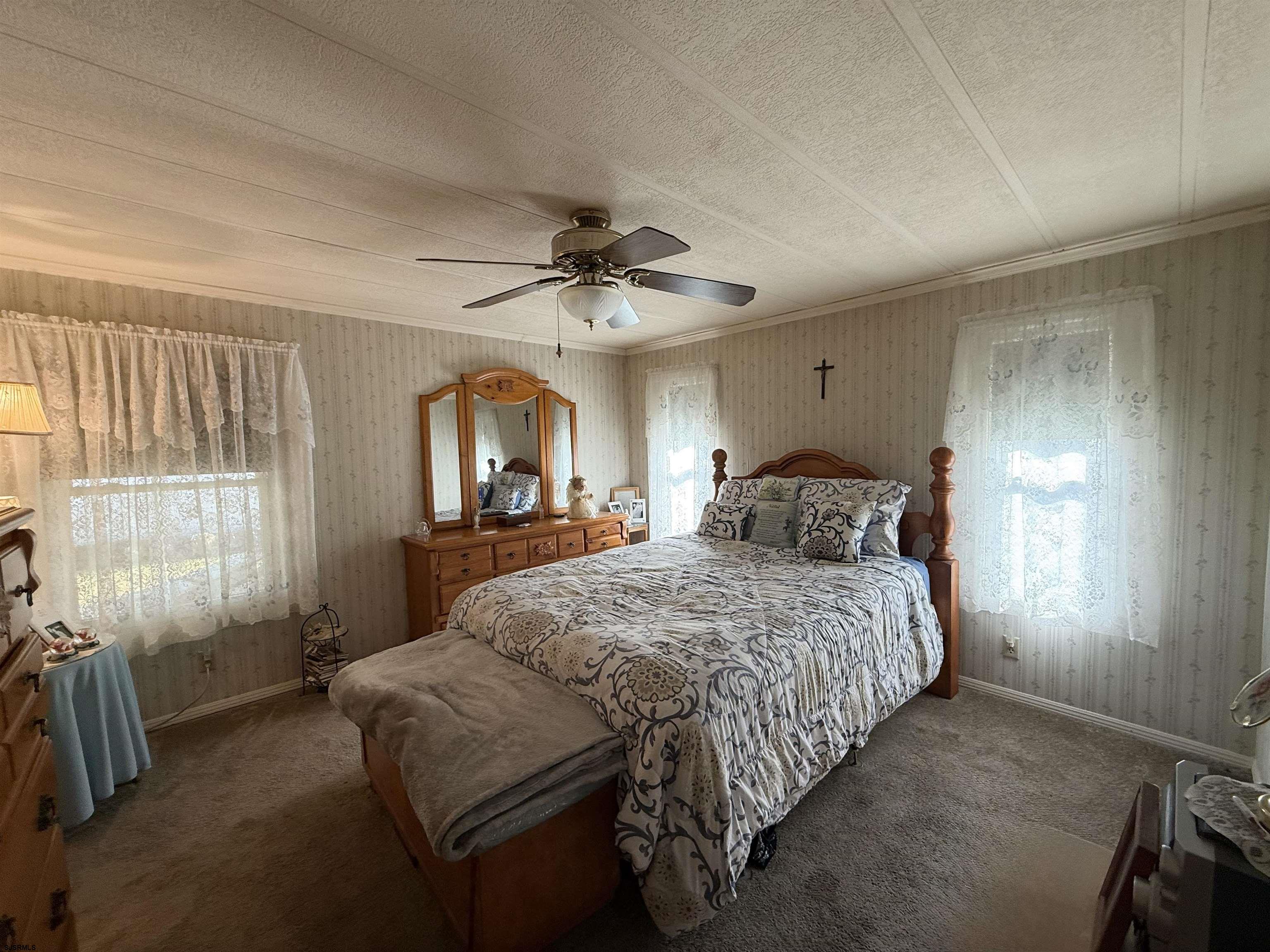 443 Priscilla Lane Buena, NJ 08310 - Photo 8 of 37 a bedroom with a bed a chandelier and a window