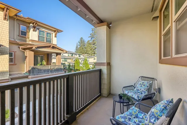 a view of a balcony with furniture