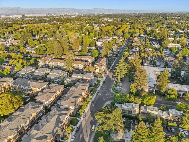 an aerial view of residential houses with outdoor space
