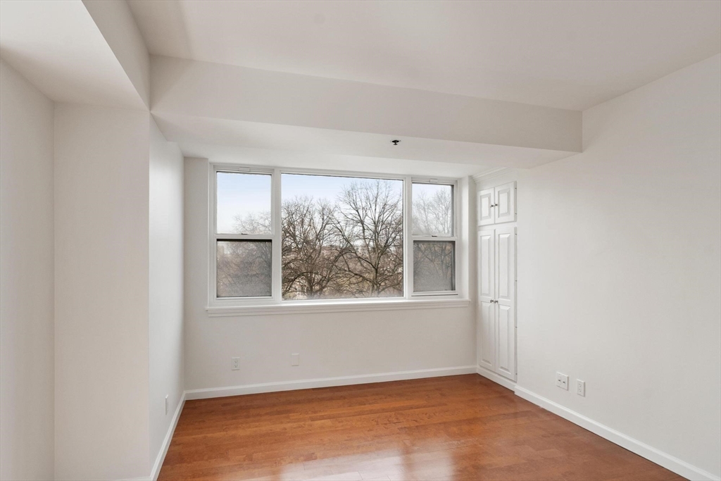 170 Tremont Street, Unit 504 Boston, MA 02111 - Photo 18 of 27 an empty room with a window