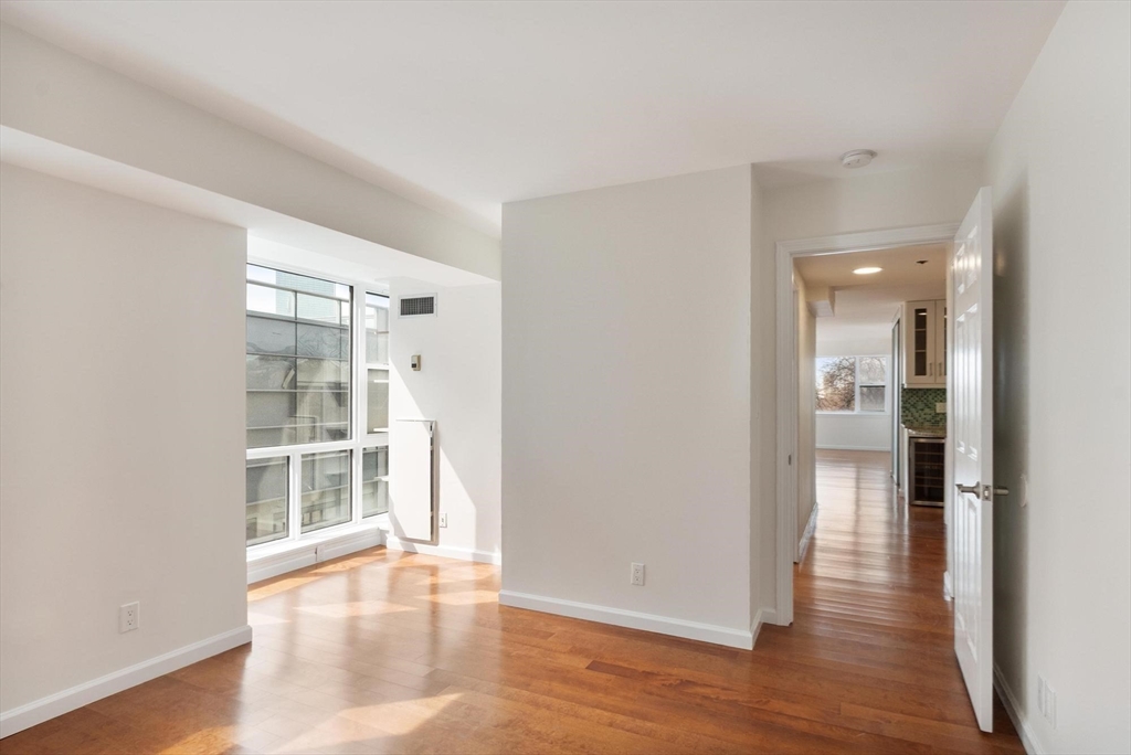170 Tremont Street, Unit 504 Boston, MA 02111 - Photo 20 of 27 a view of empty room with wooden floor