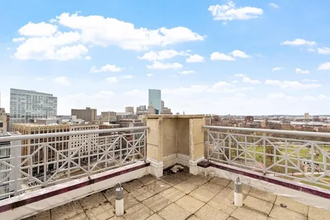 a view of a balcony with city view