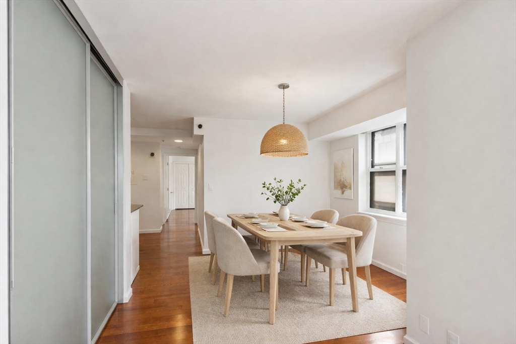 170 Tremont Street, Unit 504 Boston, MA 02111 - Photo 7 of 27 a view of a dining room with furniture and window