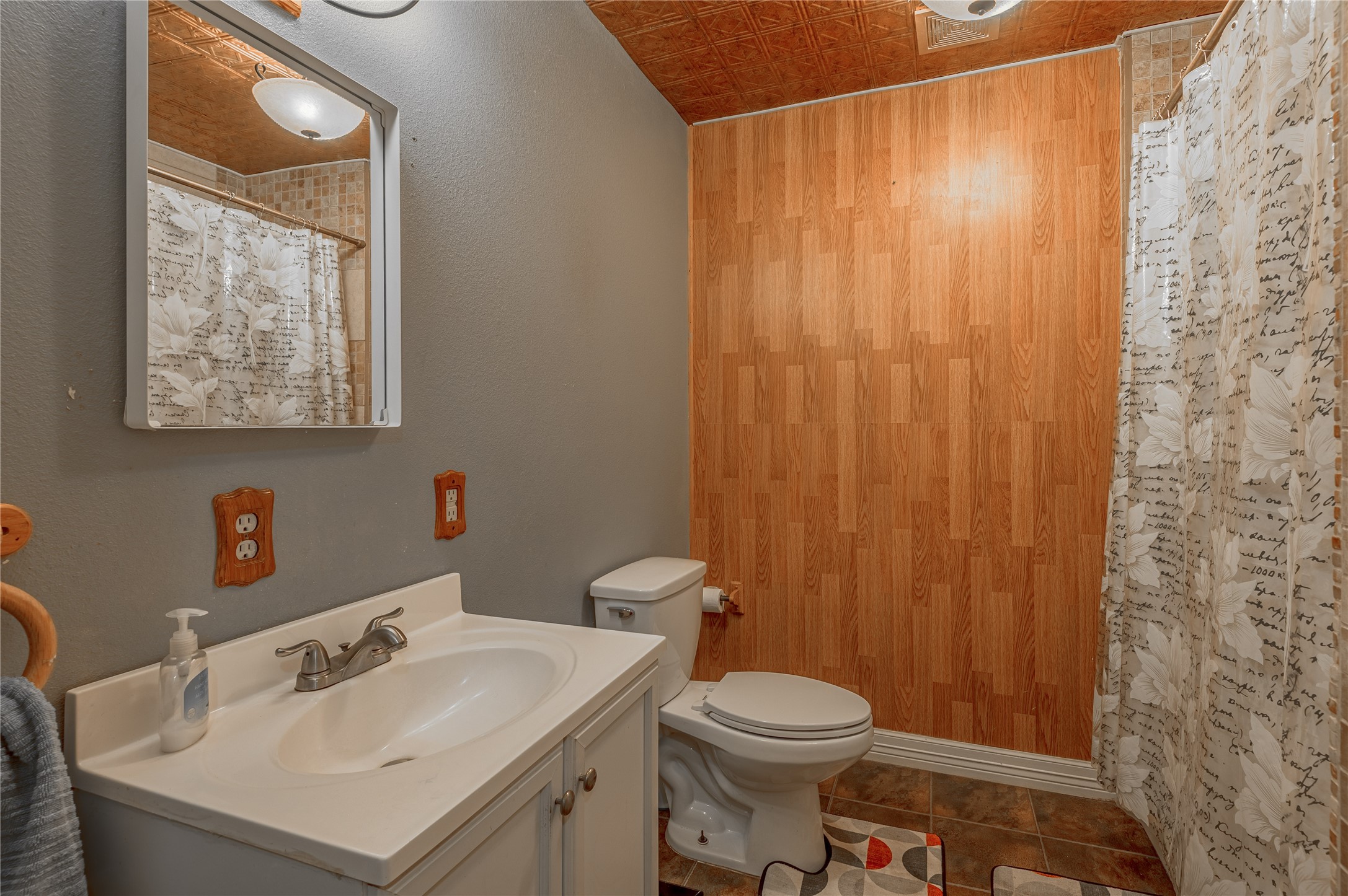47-57 Stage Coach Road Coldspring, TX 77331 - Photo 24 of 50 a bathroom with a sink a toilet and shower curtain