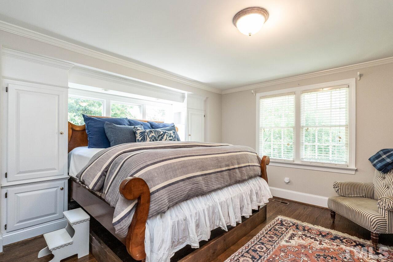 3129 Eton Road Raleigh, NC 27608 - Photo 23 of 44 a bedroom with double bed and a window