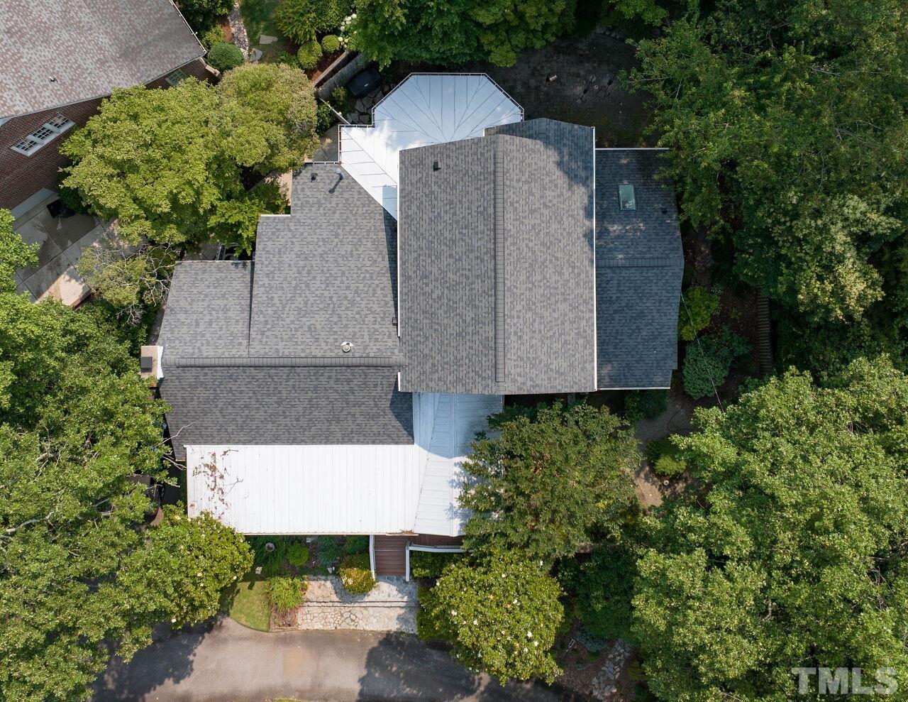 3129 Eton Road Raleigh, NC 27608 - Photo 41 of 44 an aerial view of a house with a yard and large trees