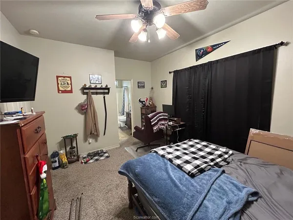 a bathroom with a sink a toilet a mirror and tub