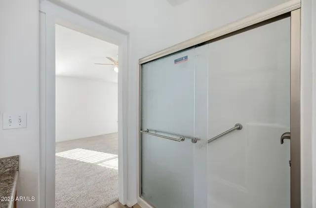 a white bath tub sitting next to a window