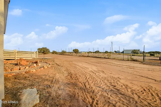 a view of wooden deck with a ocean