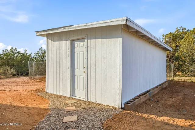 a view of a house with a snow in the background