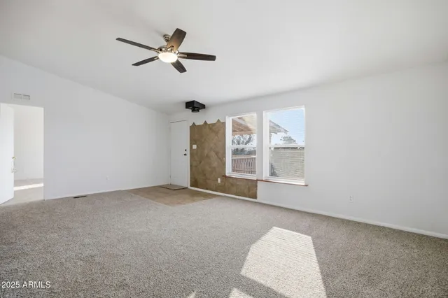 a view of a living room hardwood and bedroom