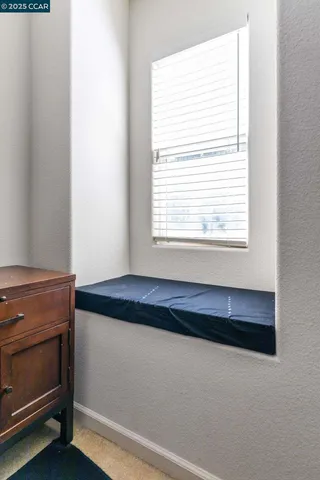 a room with a bed and a window