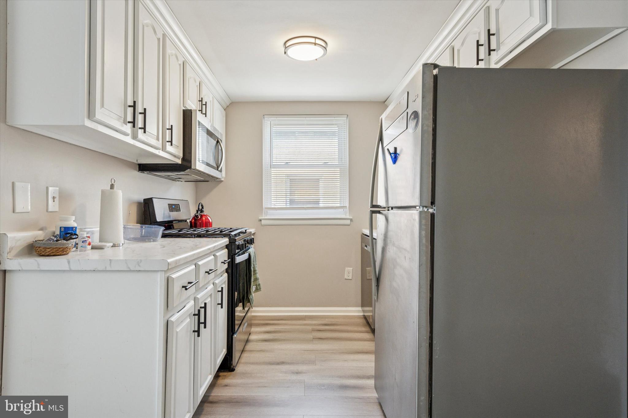 120 Clement Road Oreland, PA 19075 - Photo 18 of 34 a kitchen with stainless steel appliances granite countertop a refrigerator and a sink